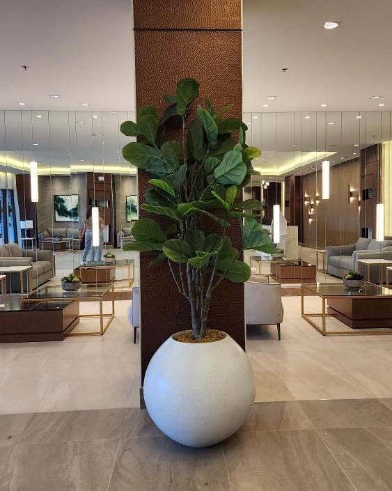 oversized fiberglass planter in entry hall
