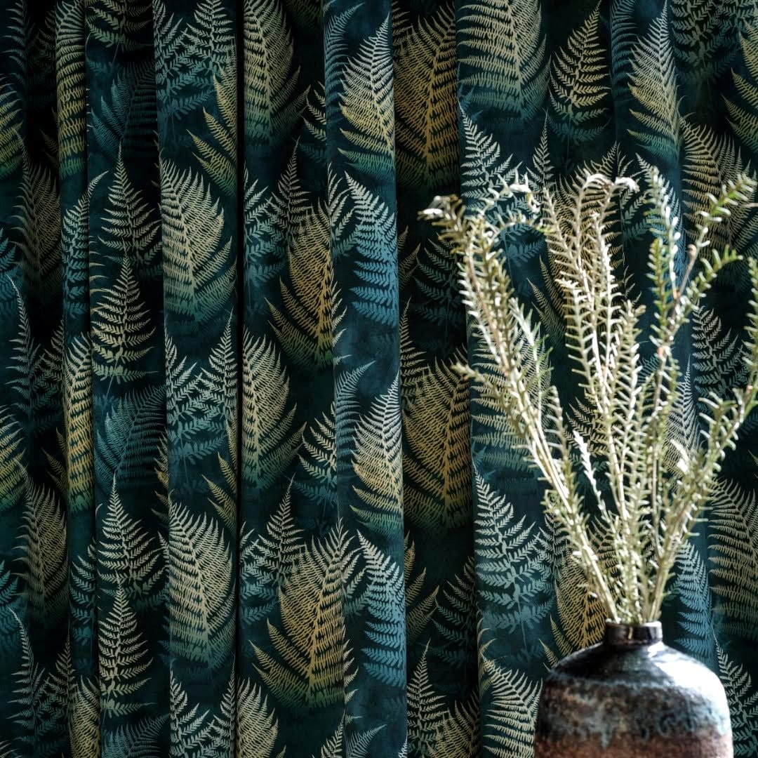 Soft velvet drapes and delicate ferns