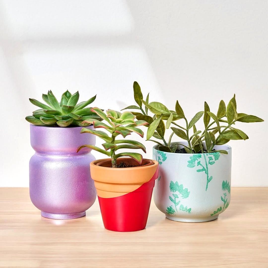 Pearlized finish plant pots with shimmering designs