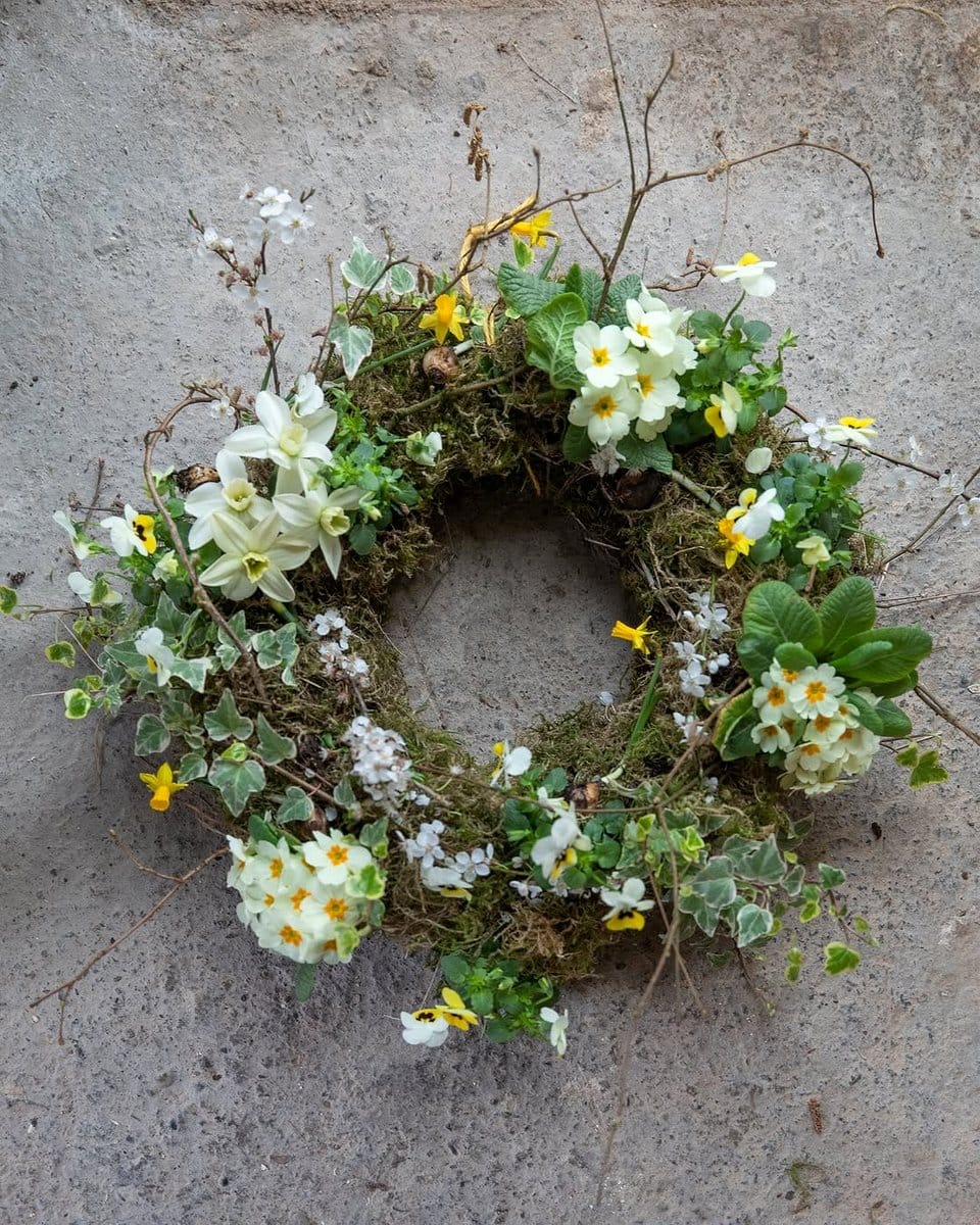 moss-wrapped seasonal wreath