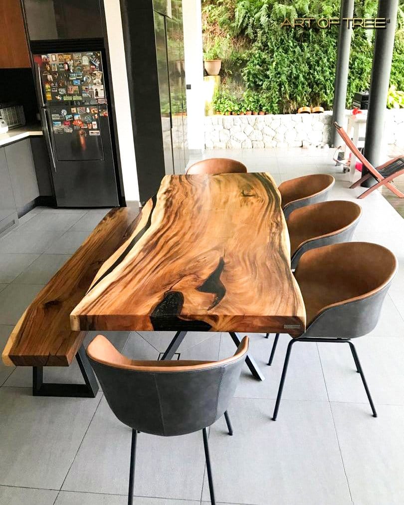 Wooden dining table with centerpiece plant