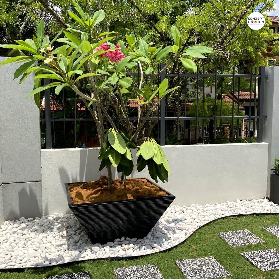 Minimalist sand and stone zen planter with greenery