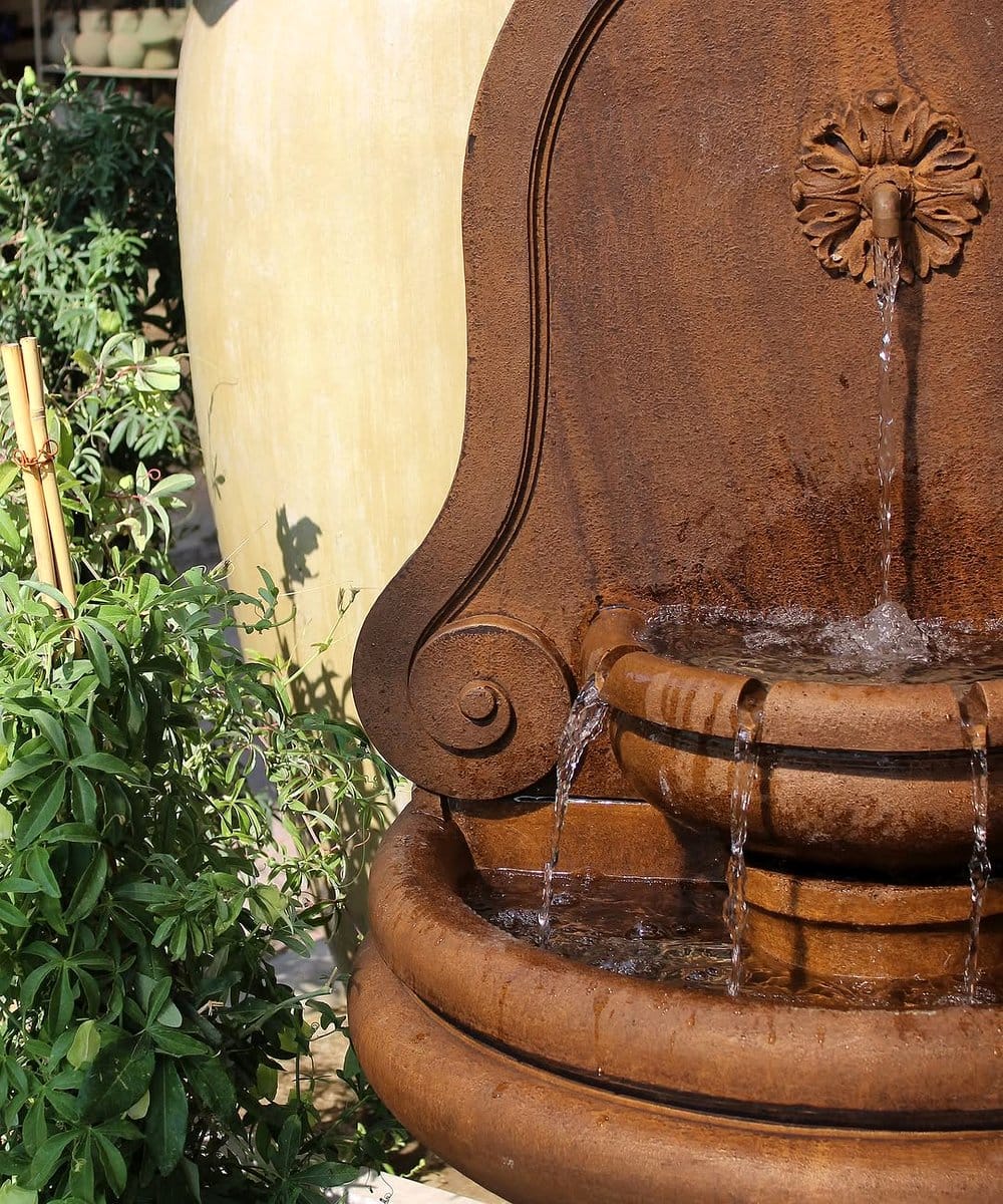 leafy greens in tiered fountain