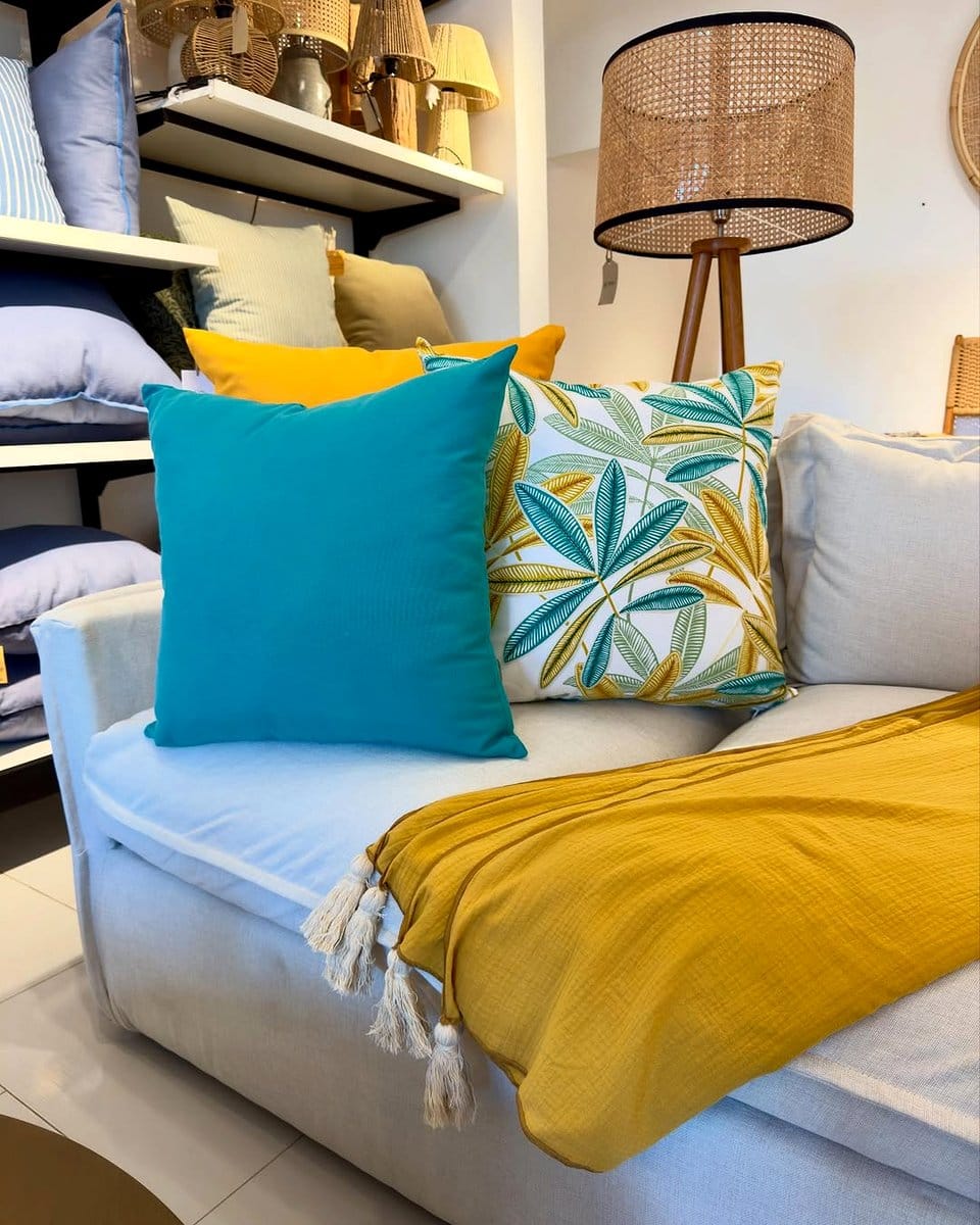 couch with tropical leaf pillows