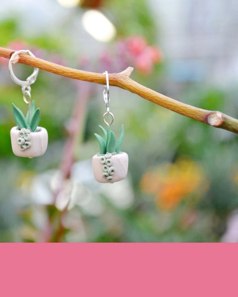 close-up of succulent earrings
