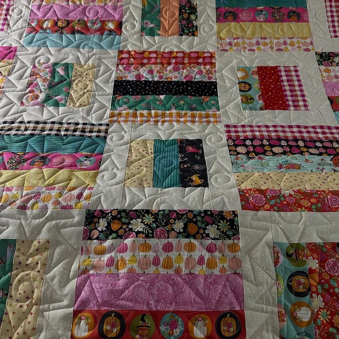 Assorted colorful patchwork quilts
