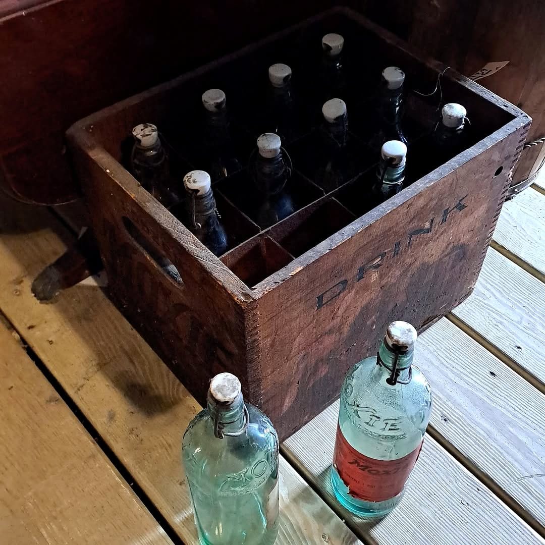 retro wooden milk crate with bottles