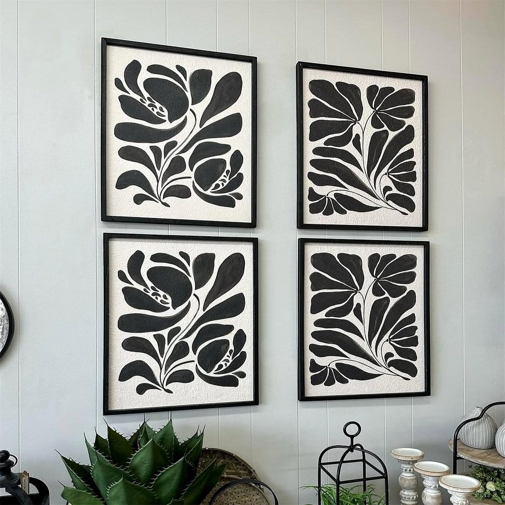 Black-and-white botanical prints on wall