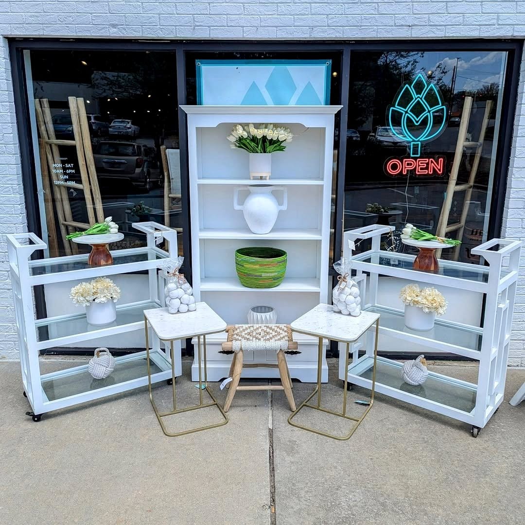 Whitewashed wooden ladder shelf with plant hangers
