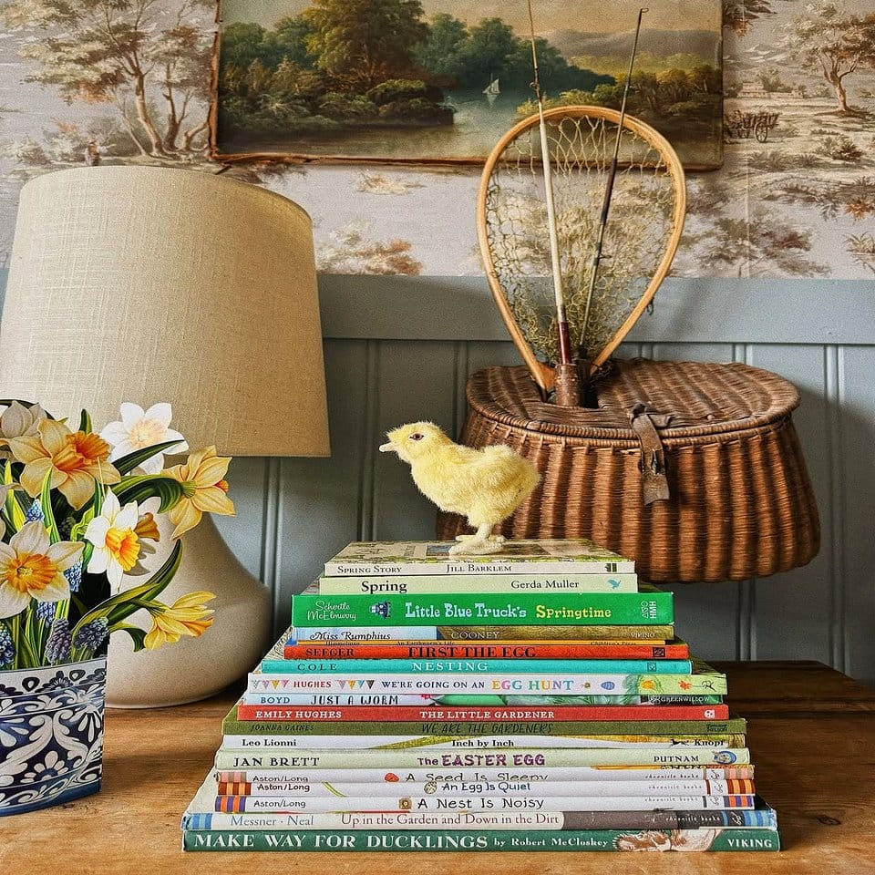Stacked antique books with potted succulents
