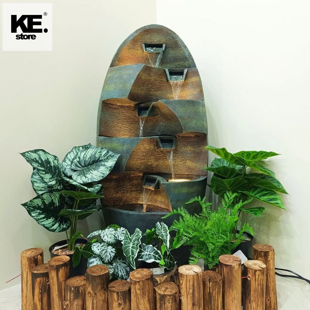 tabletop water fountain with greenery