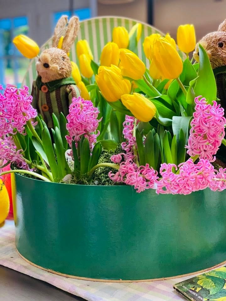 bright flowers in antique hat box