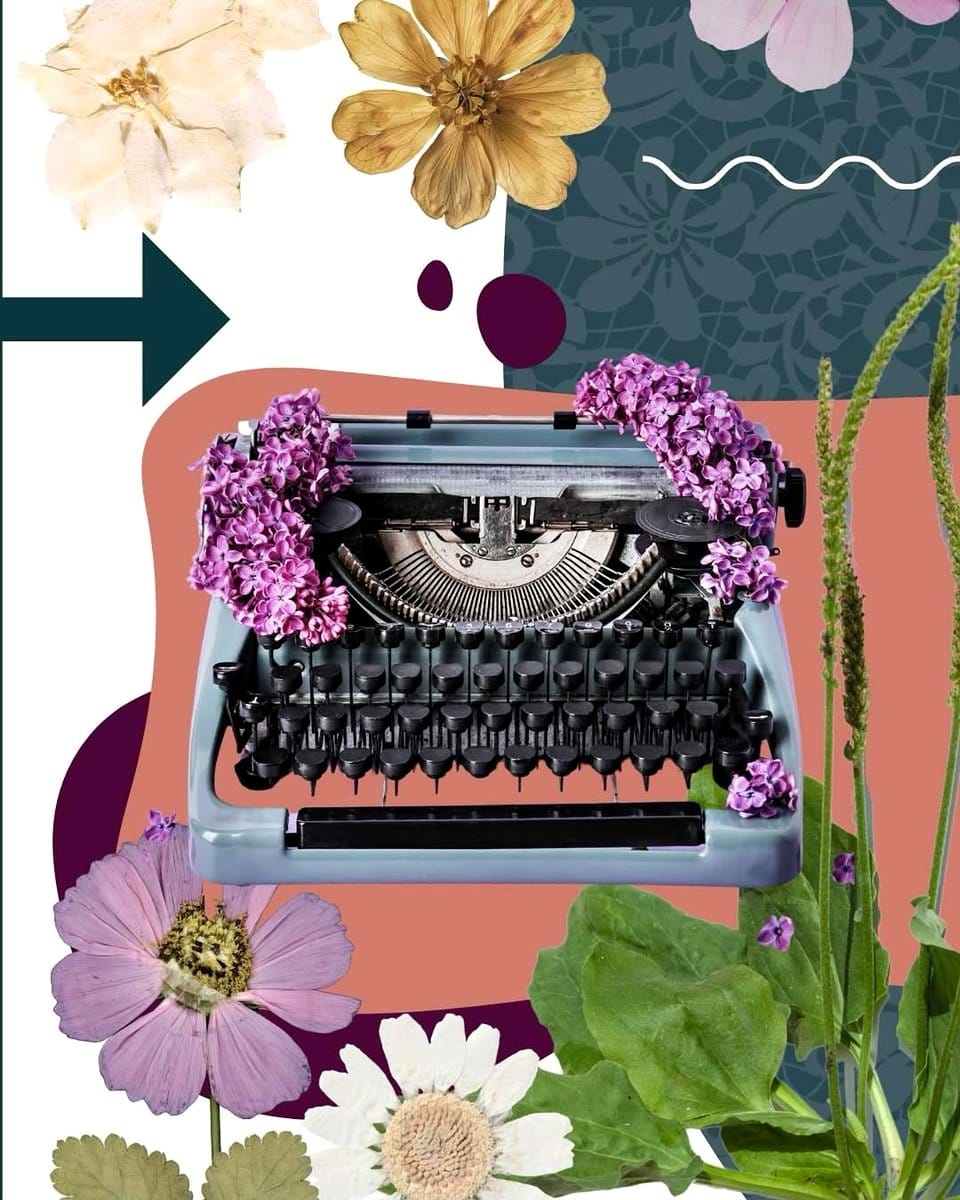 typewriter with wildflowers in garden