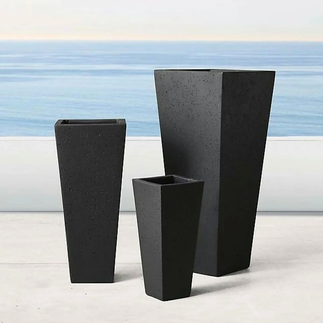 tall tapered fiberglass planters flanking front door