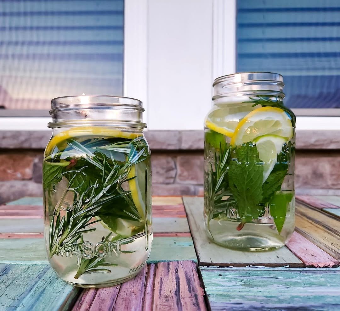 Mason jars with herbs on a patio