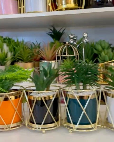 Metallic pot with Afrocentric symbols
