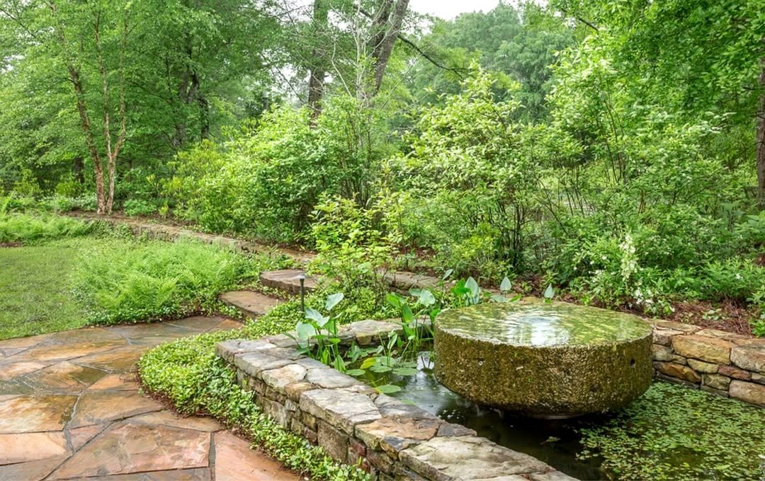 rustic fountain with woodland plants