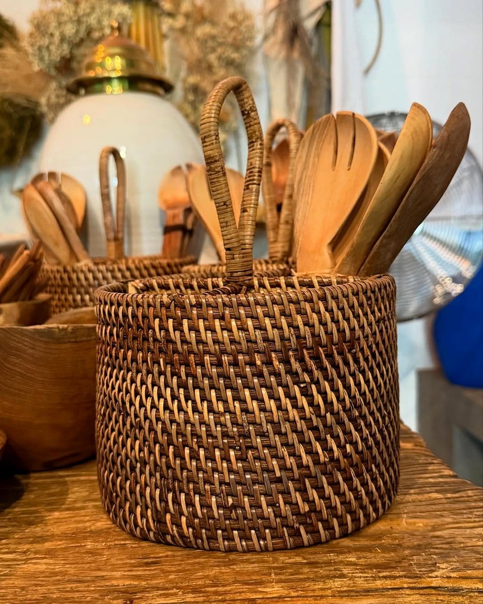 woven basket with kitchen utensils