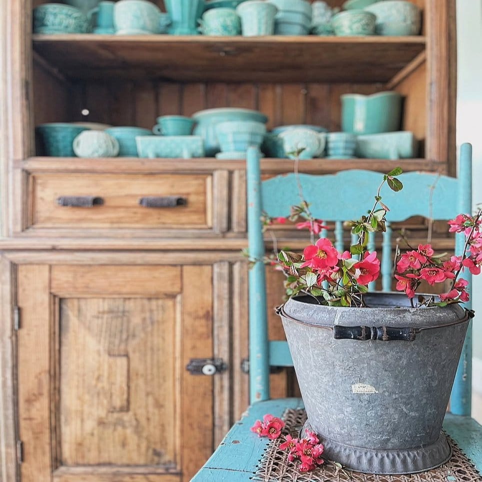 Vintage metal milk crate with blooming flowers