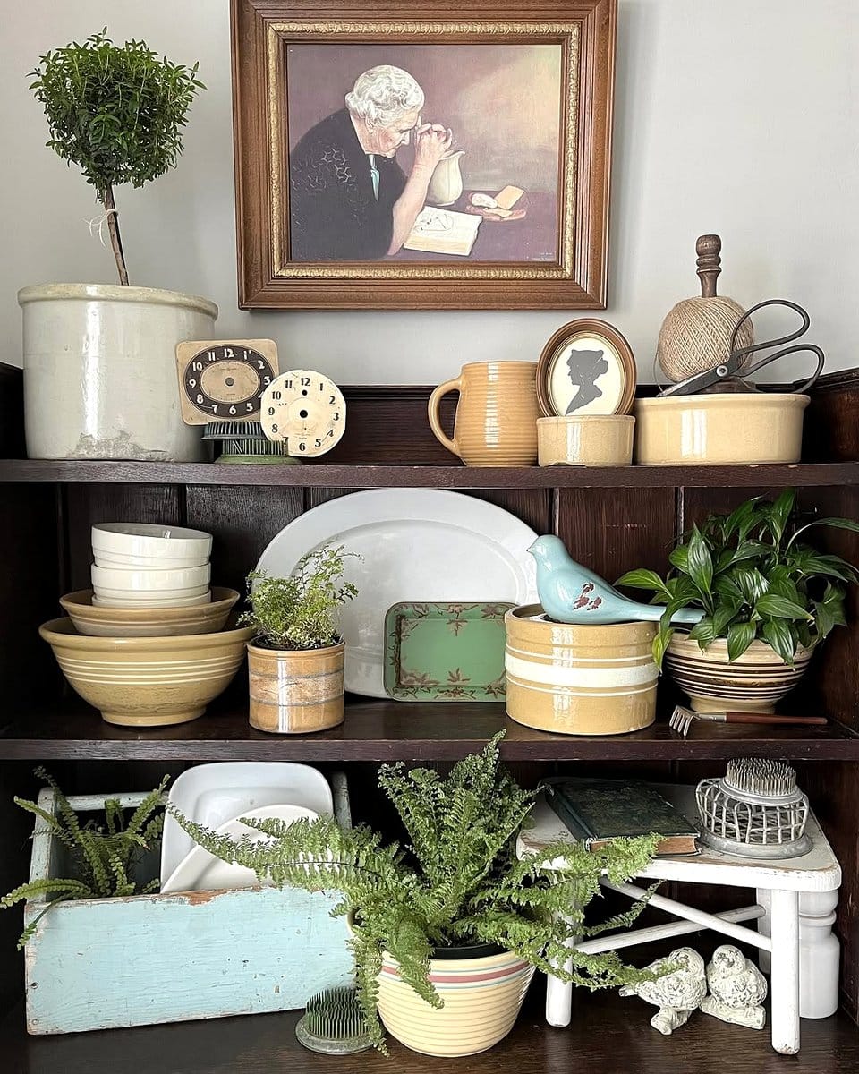 hutch with antique plant vases