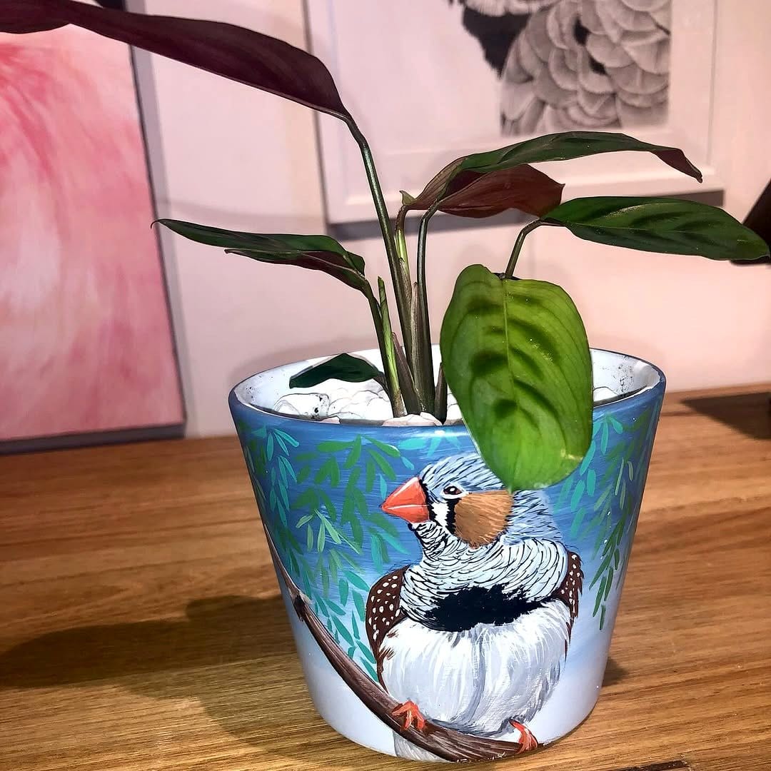 watercolor-painted plant pots with tropical motifs