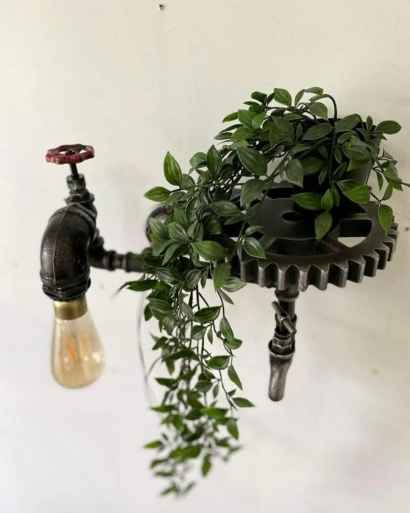 industrial pipe plant stand with cactus