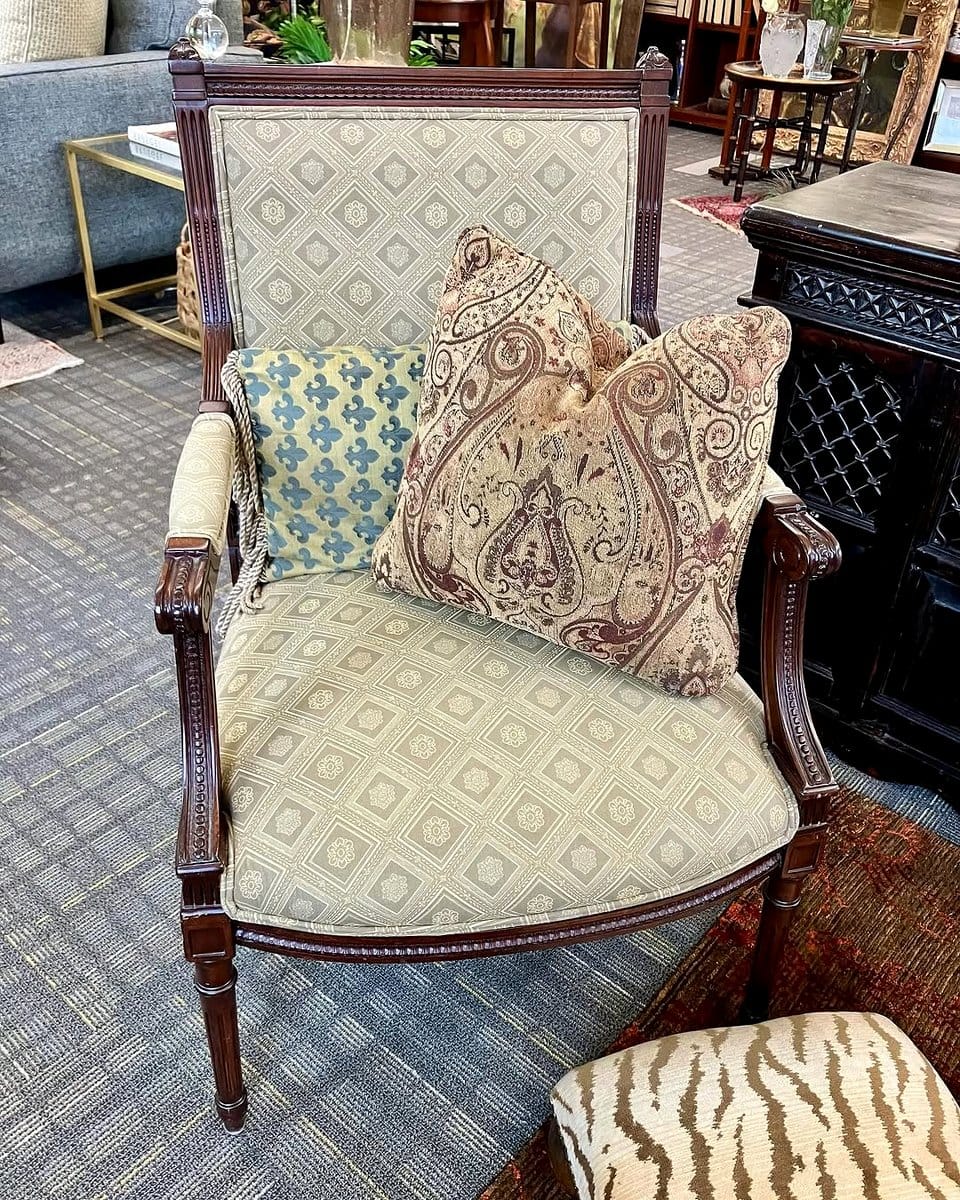 Wicker armchair with floral cushion