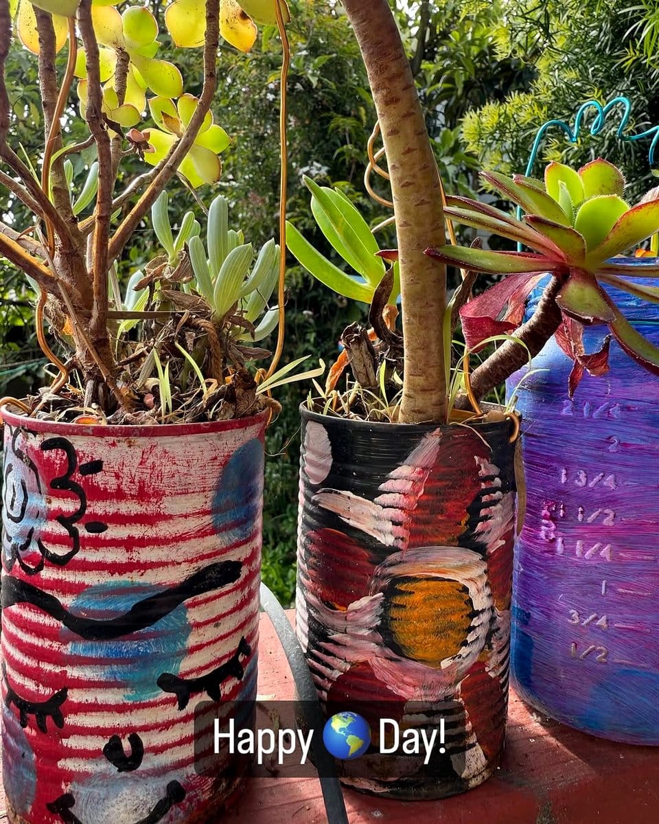 painted tin cans with flowers