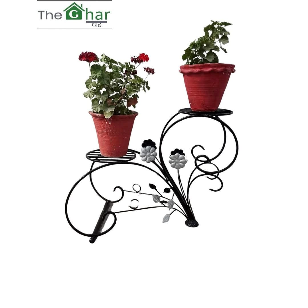 Vintage rustic iron plant stand with greenery