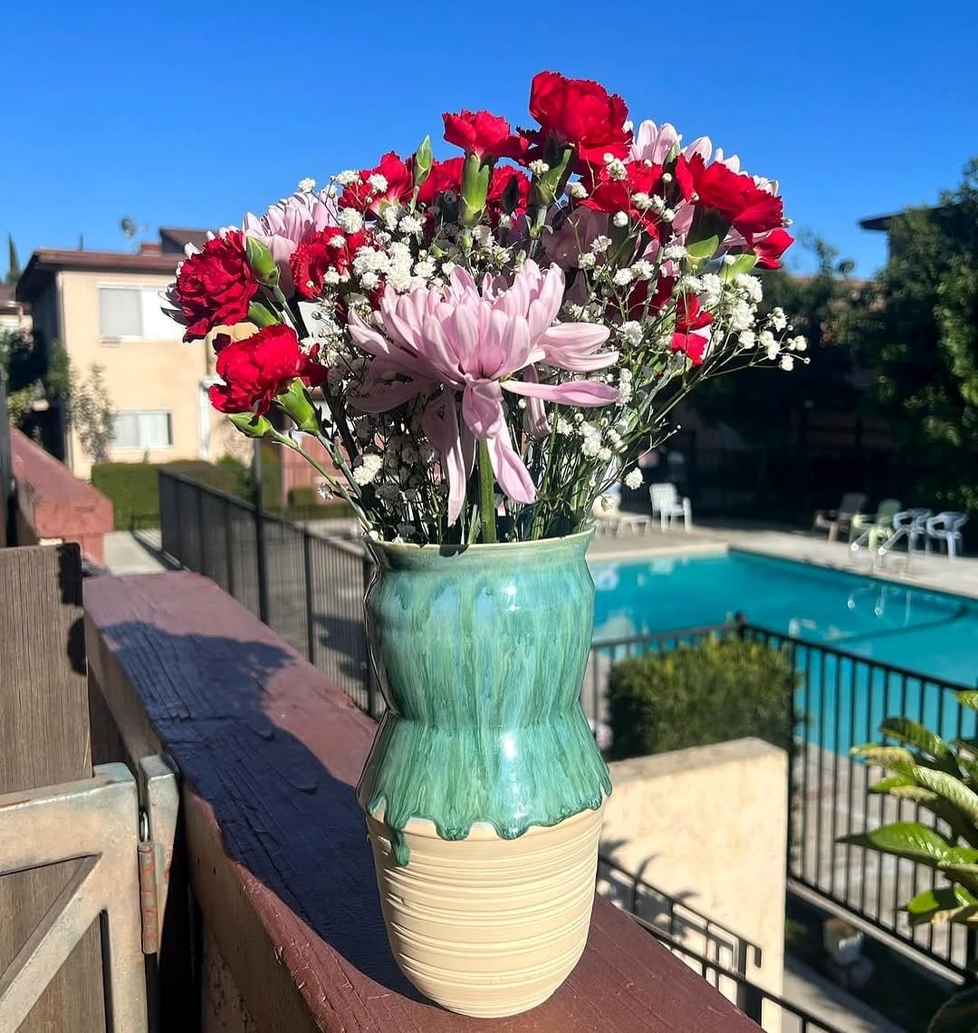 glazed ceramic vase with fresh flowers