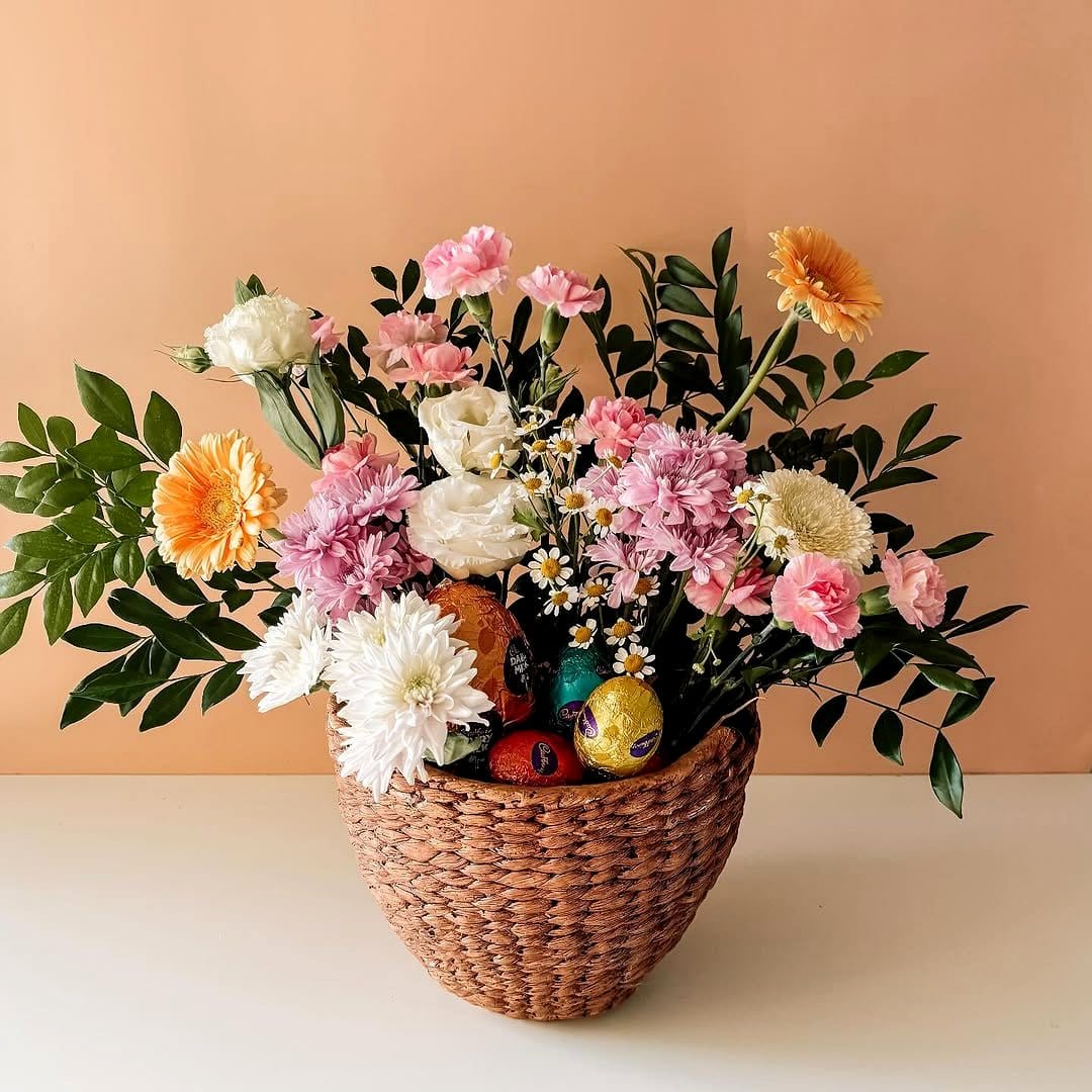 Large wicker basket with mixed flowers
