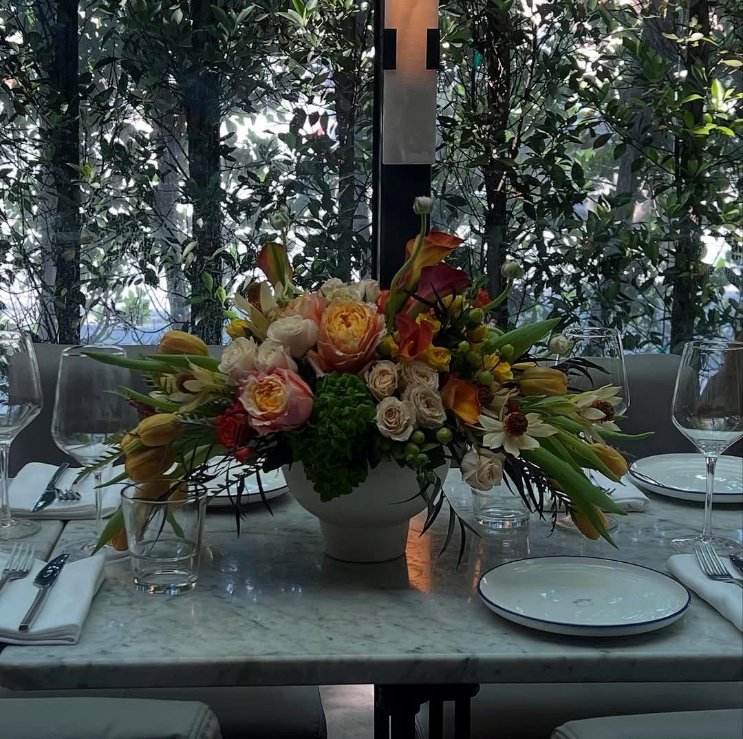 lush plant centerpiece on dining table