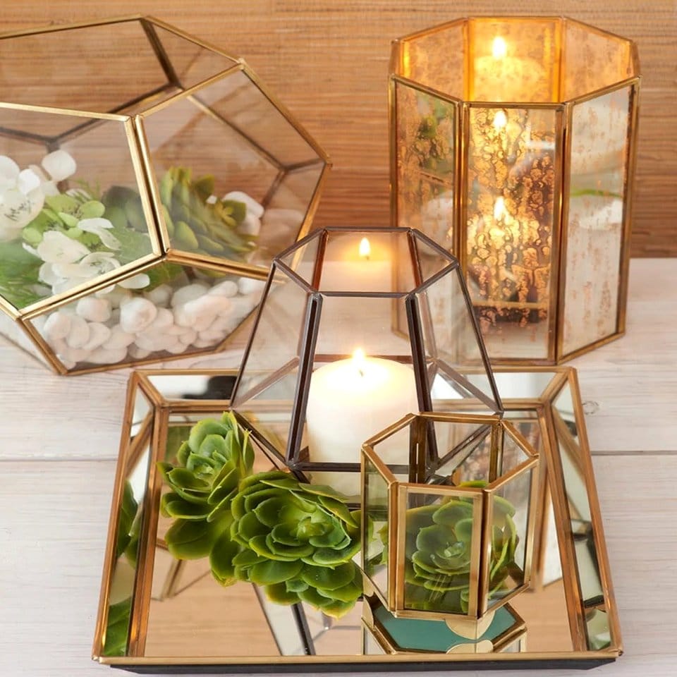 Rustic vintage lanterns with candlelight and plants