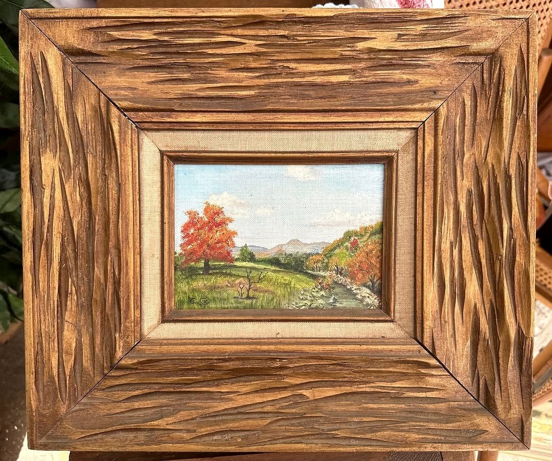 Rustic landscape painting with wooden frame