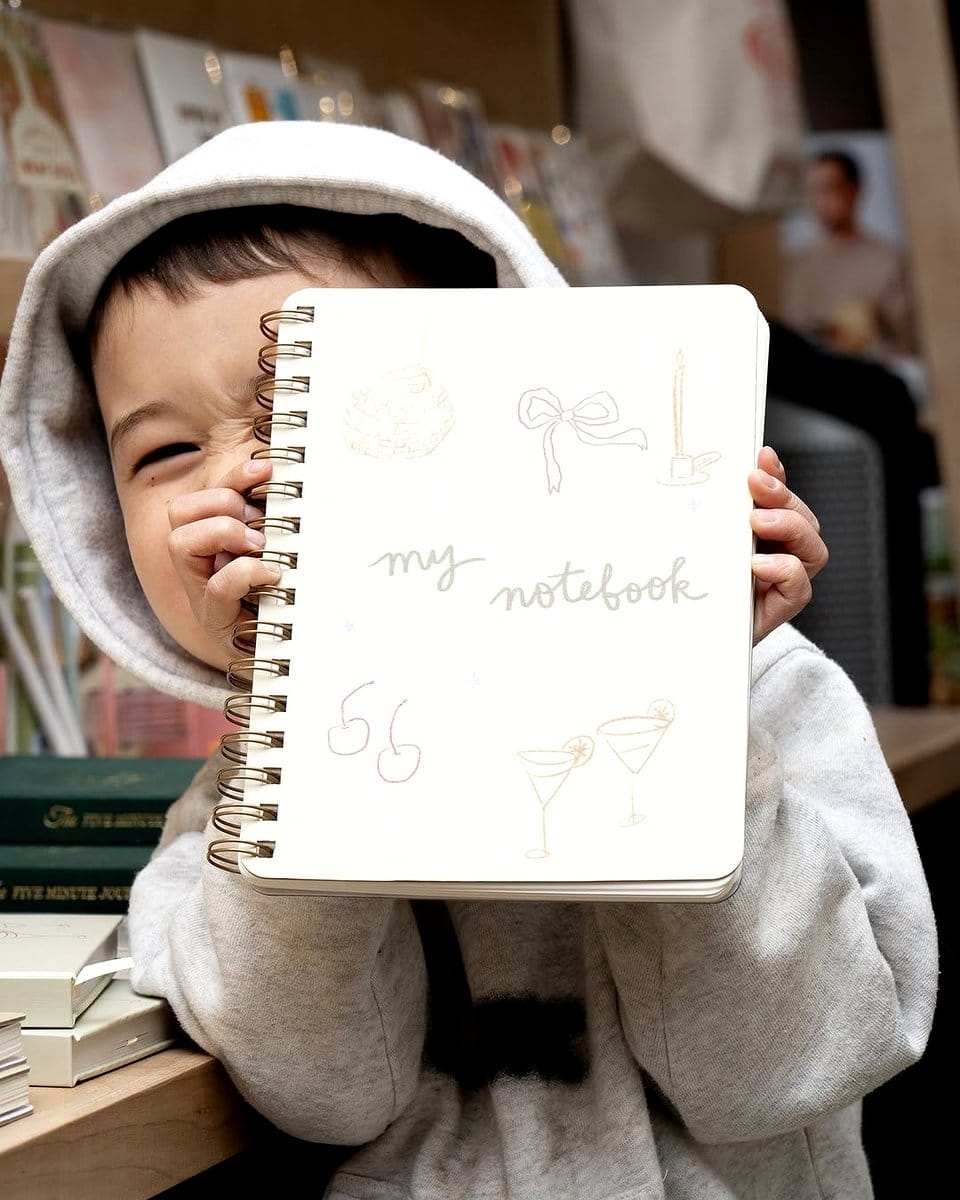 child with notebook