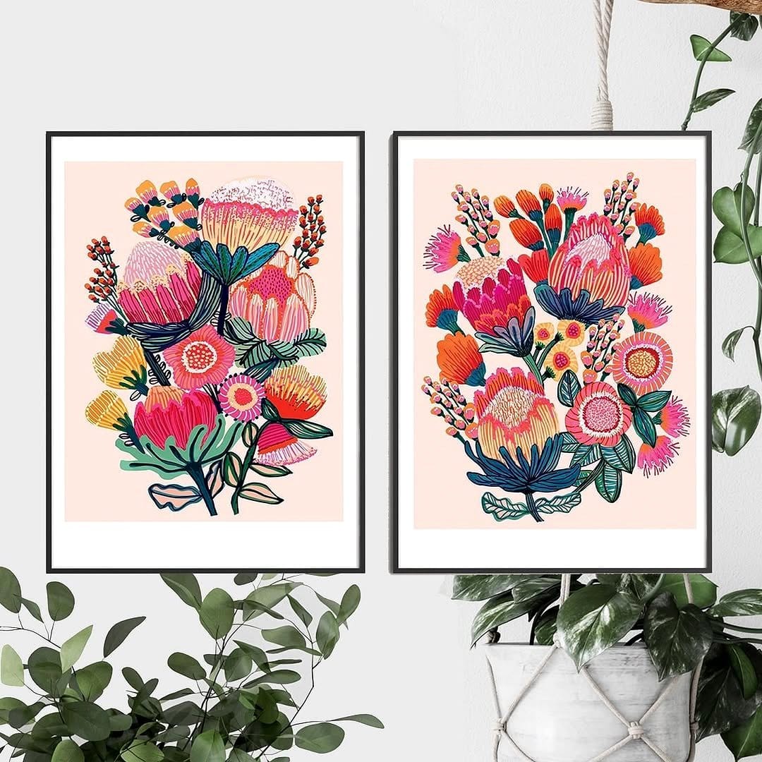 Vibrant botanical gallery wall above bed