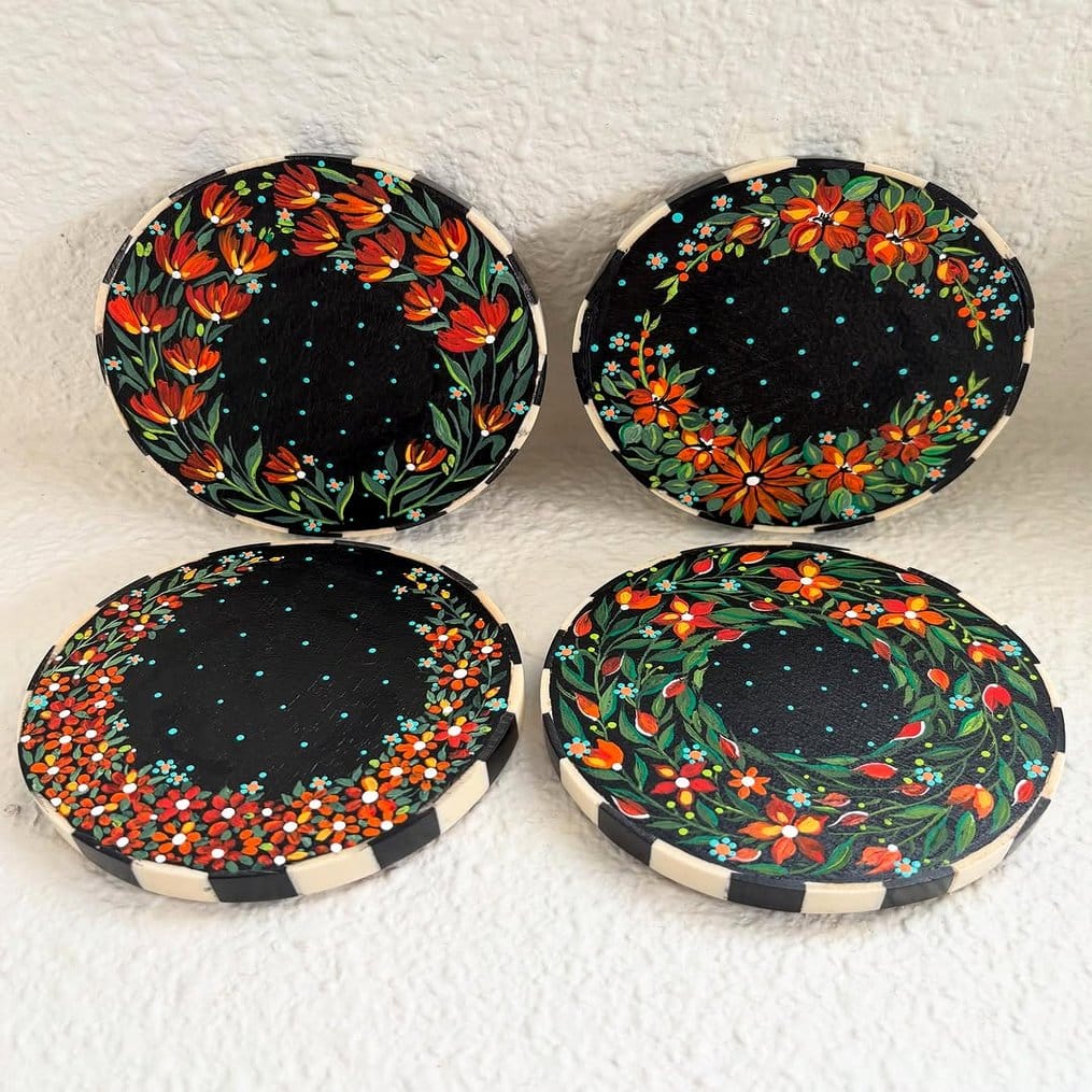 Drink coasters with plant and tattoo motifs