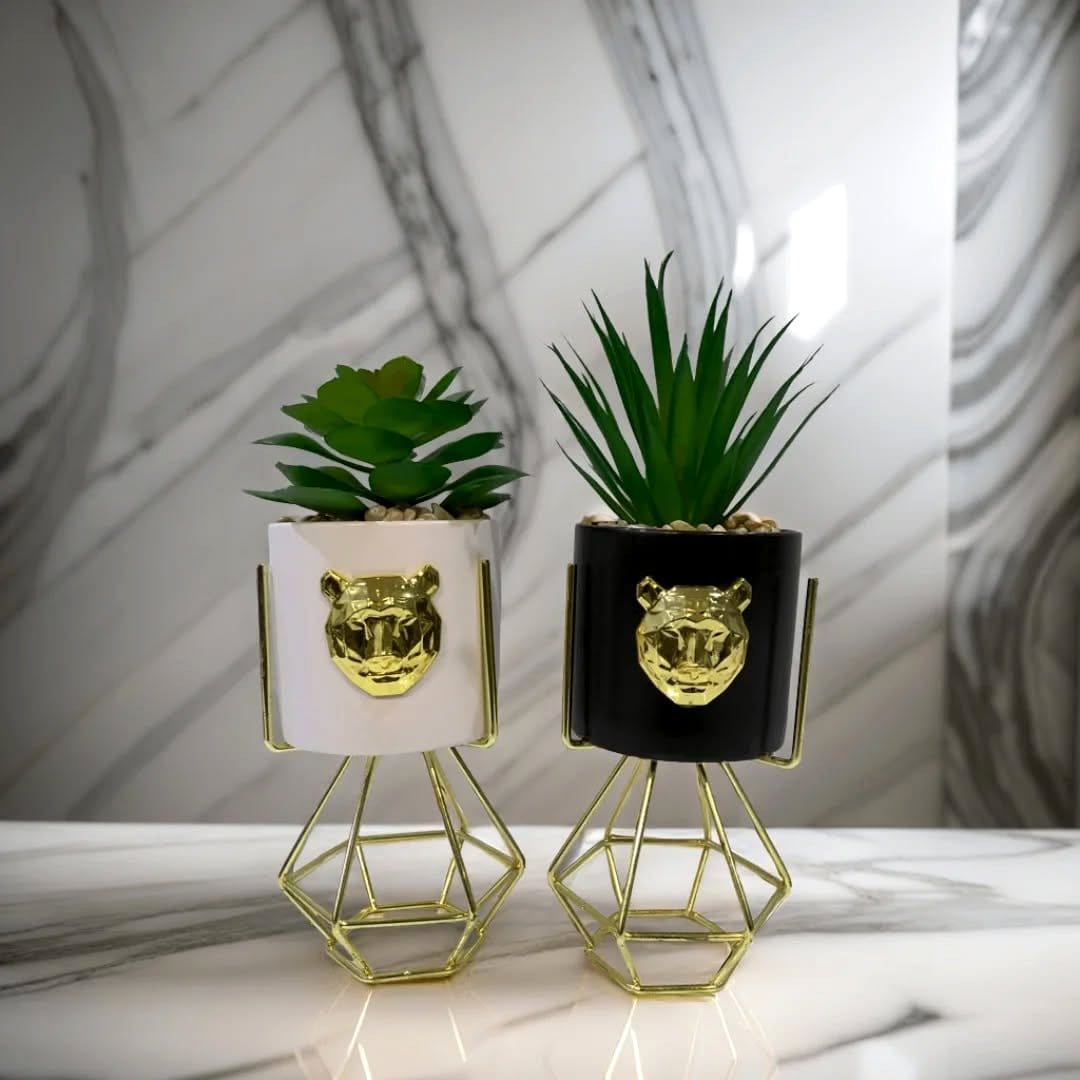 Geometric planters with succulents on wrought iron stand