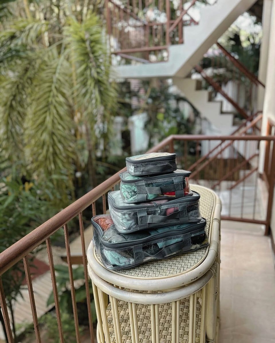 stacked suitcases with plants