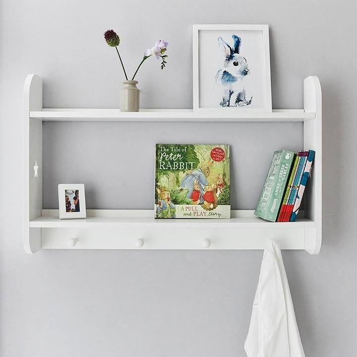 hollowed log wall shelf with books