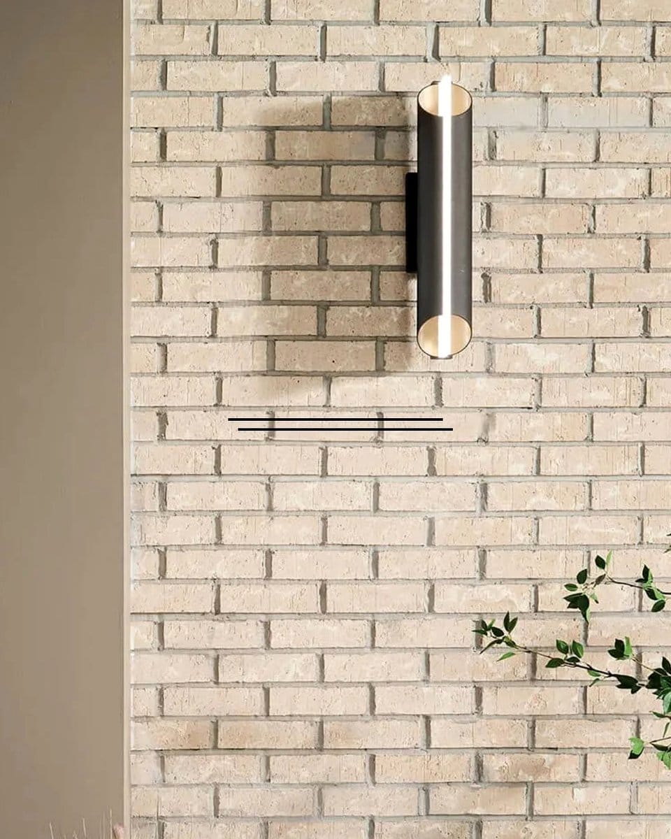 stylish wall sconce on brick wall