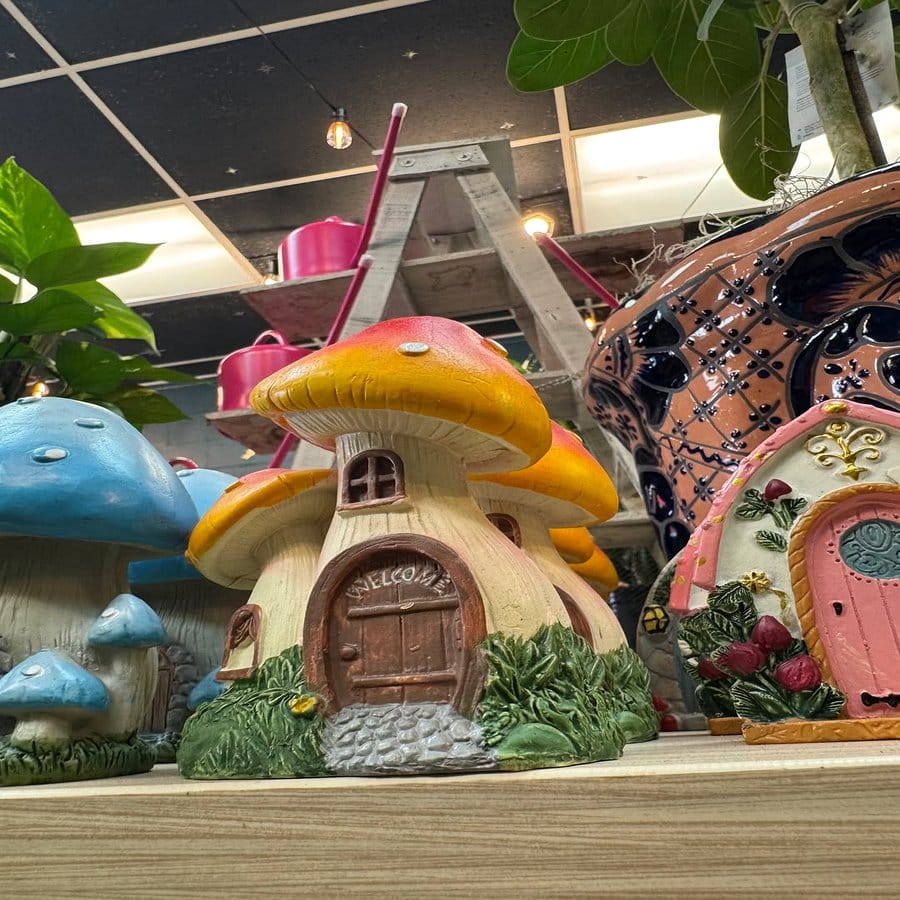 Miniature gnome village with moss and mushrooms