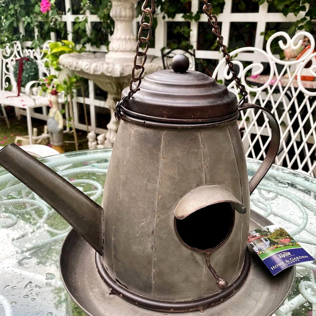 Birdcage with hanging herbs