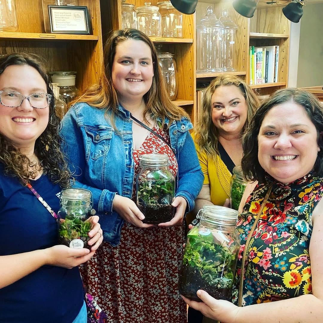 friends crafting terrariums together