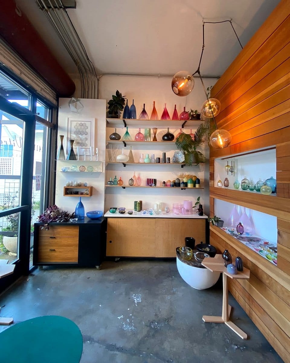 colored glass vases on a shelf