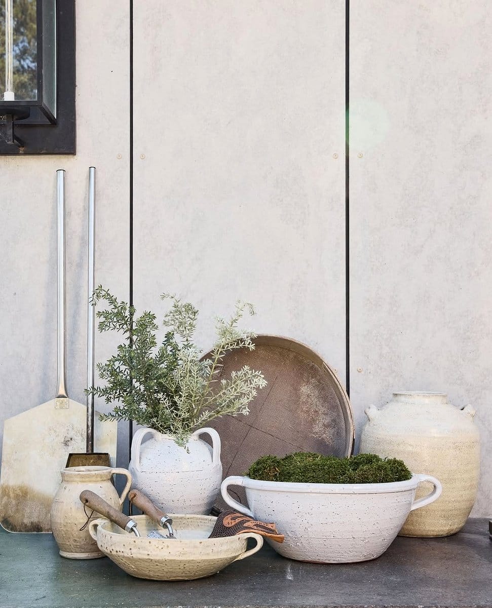 ceramic pots on wooden bench