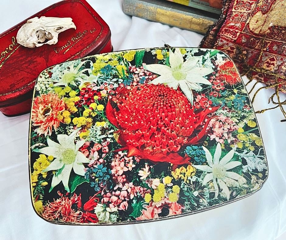 vintage tin container with wildflowers