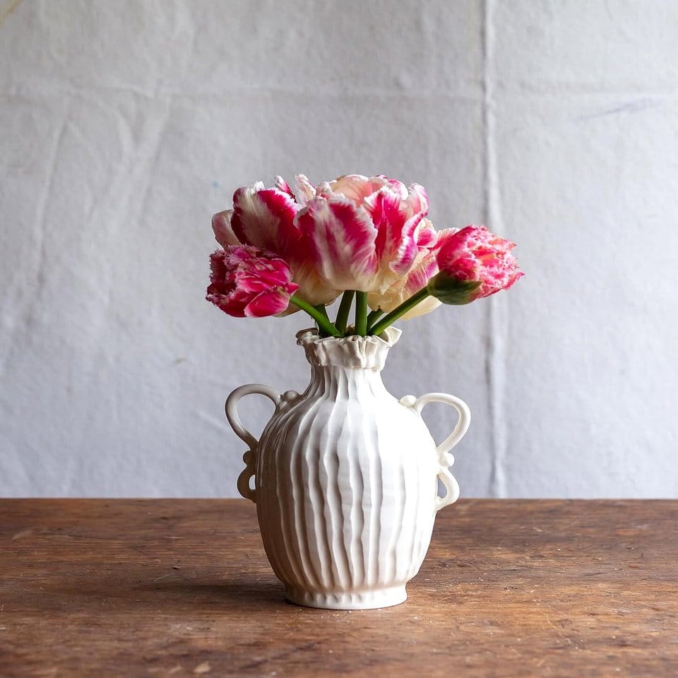 Clay pots with vibrant seasonal flowers