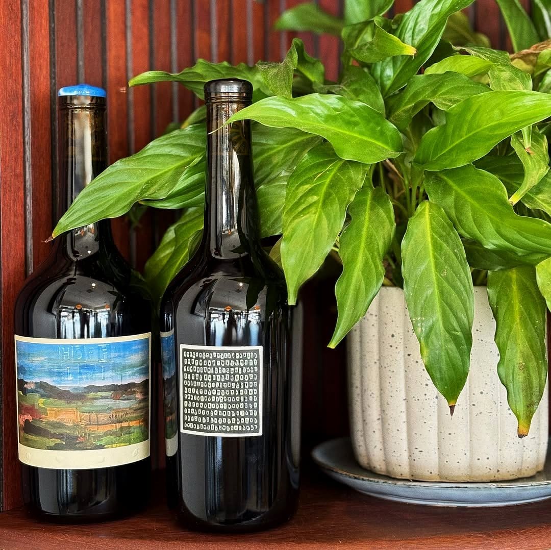 wine bottle planters with vintage labels