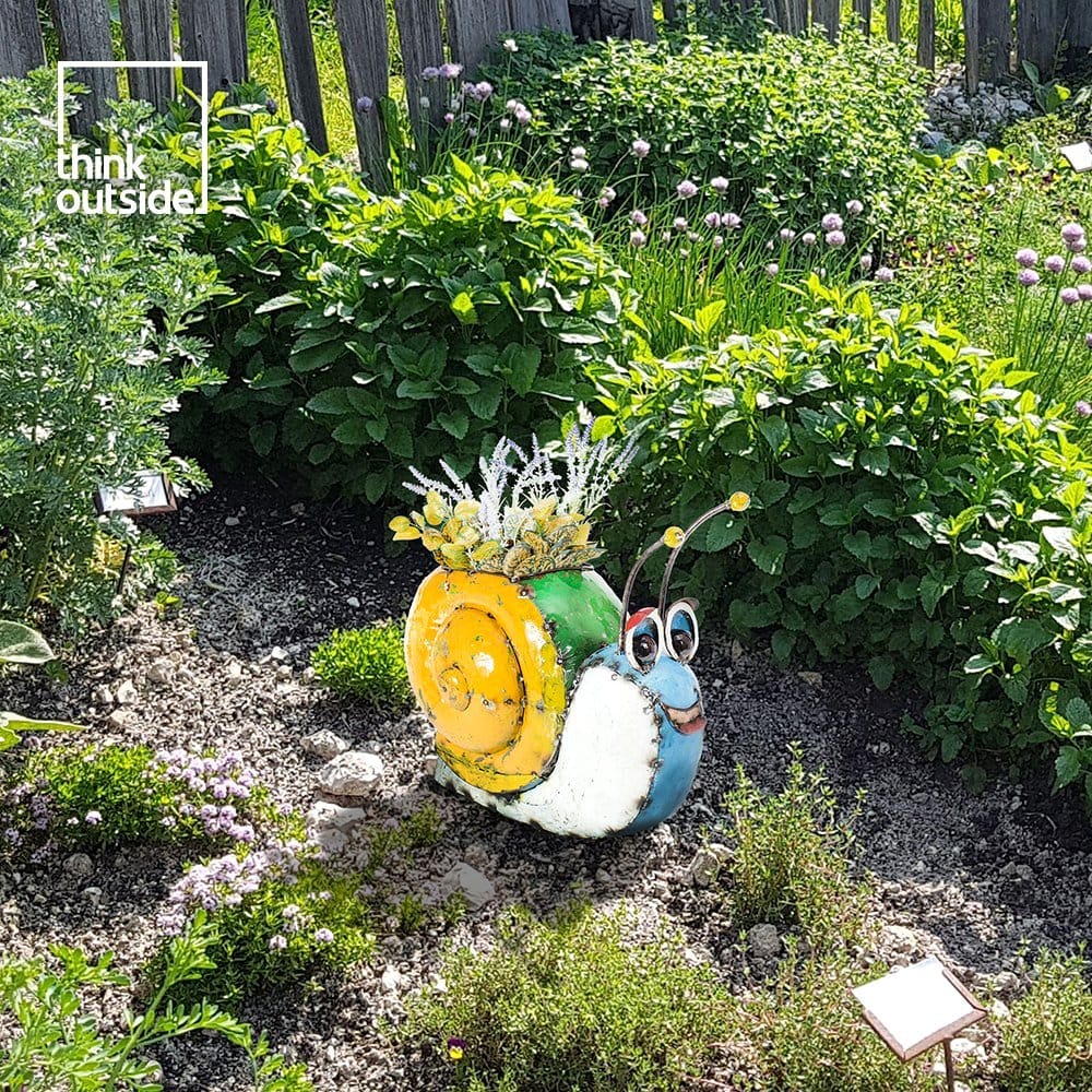 eco-friendly plant sculpture with recycled materials